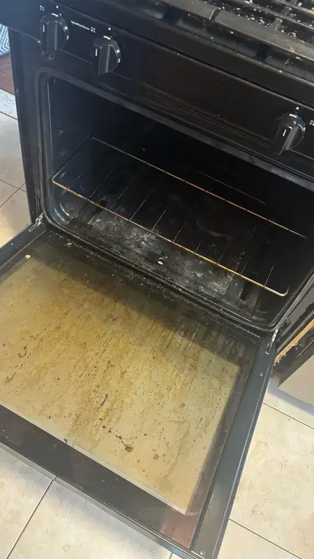 Dirty oven interior with baked-on grease