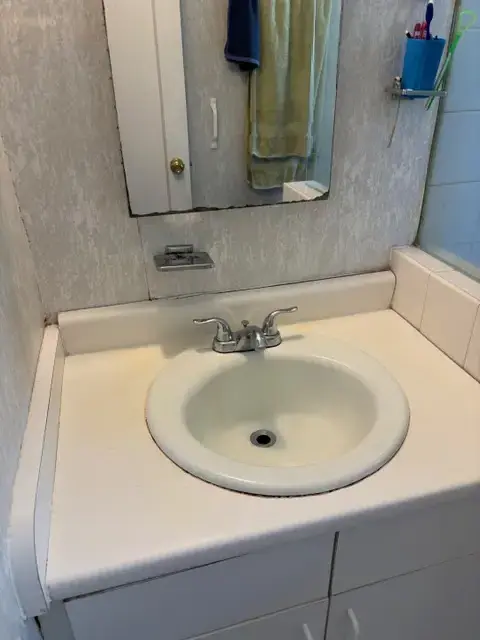 Clean bathroom sink after residential cleaning